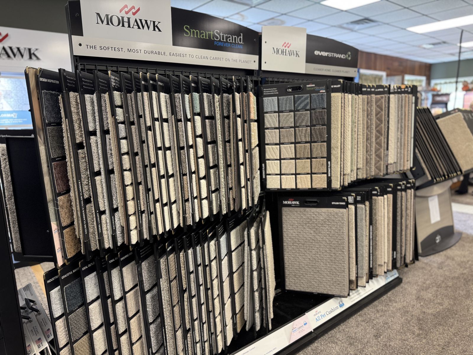 Mohawk SmartStrand and EverStrand carpet sample racks in the A & A showroom